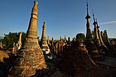 Inle Lake Myanmar. Indein, on the summit of a hill the  Shwe Inn Thein Paya a cluster of hundreds of ancient stupas. Many of them are ruined and overgrown with bushes. 